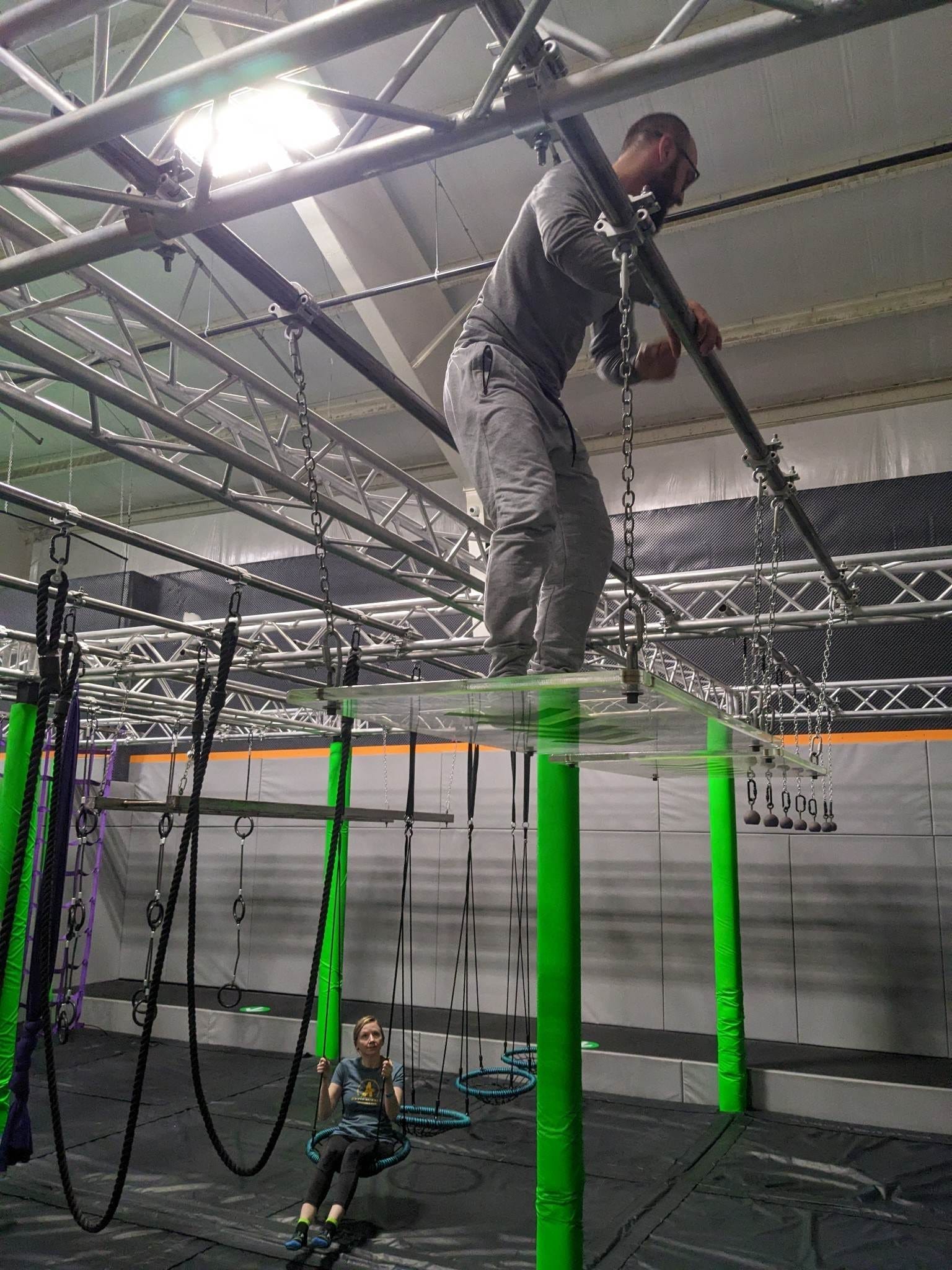 Two people at a trampoline park